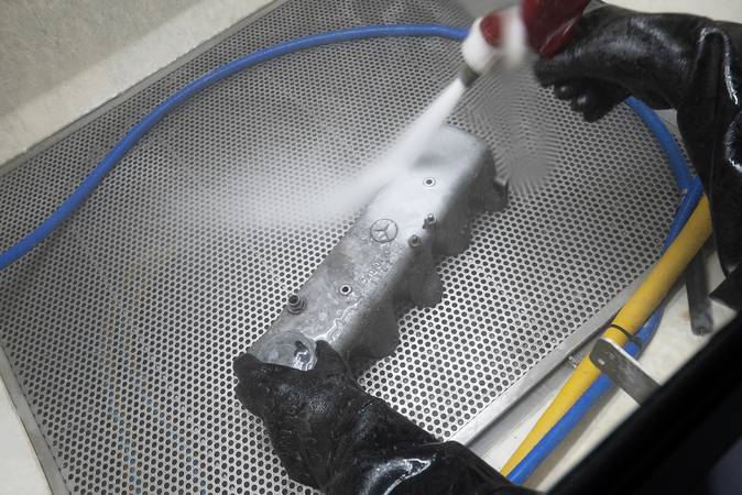 Wet blasting in cabinet